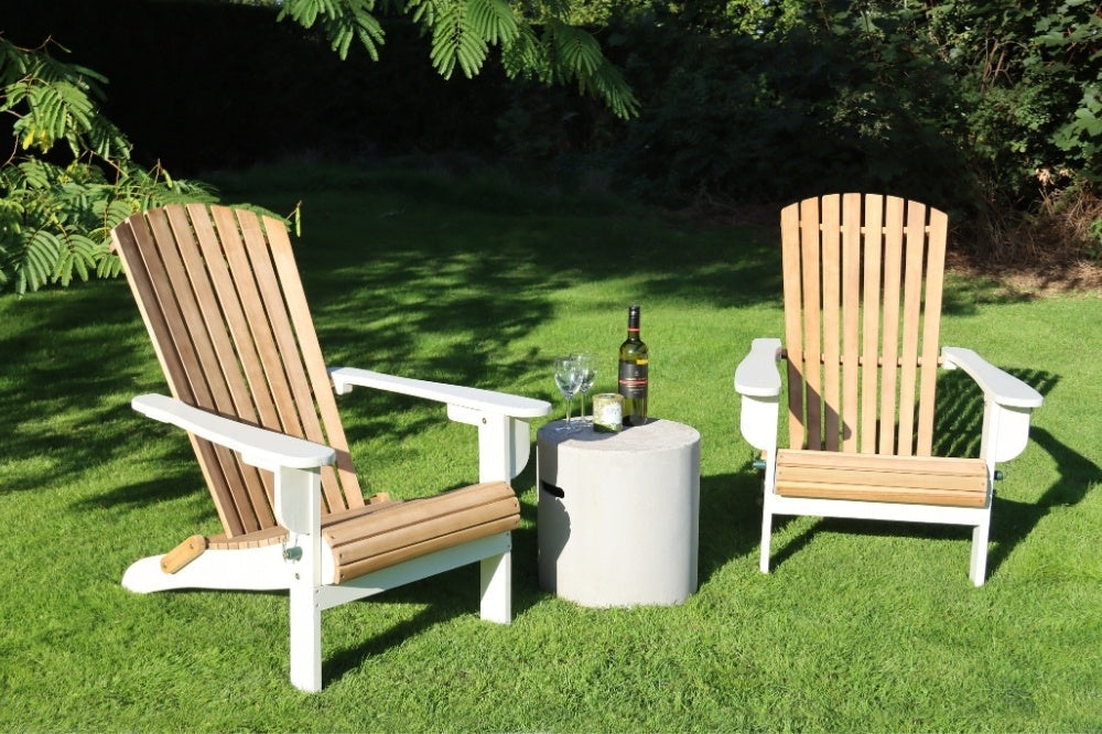Wooden garden chairs on a lawn under a tree