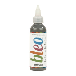 A bottle containing coloured gel paint, on a white background of bleo slate grey