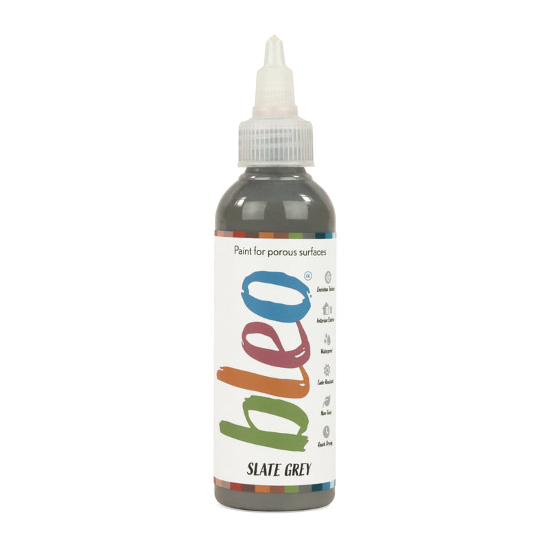 A bottle containing coloured gel paint, on a white background of bleo slate grey