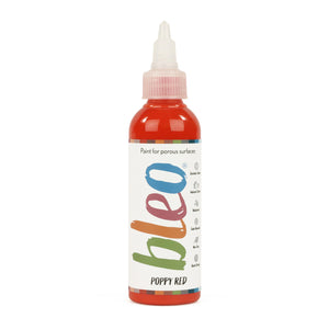 A bottle containing coloured gel paint, on a white background of bleo poppy red