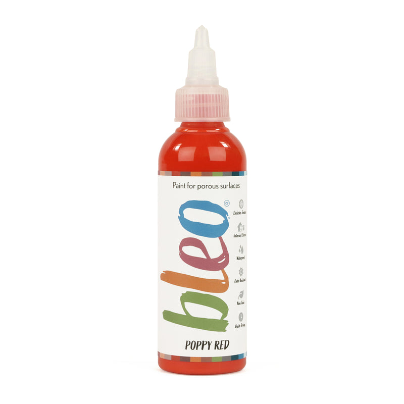 A bottle containing coloured gel paint, on a white background of bleo poppy red