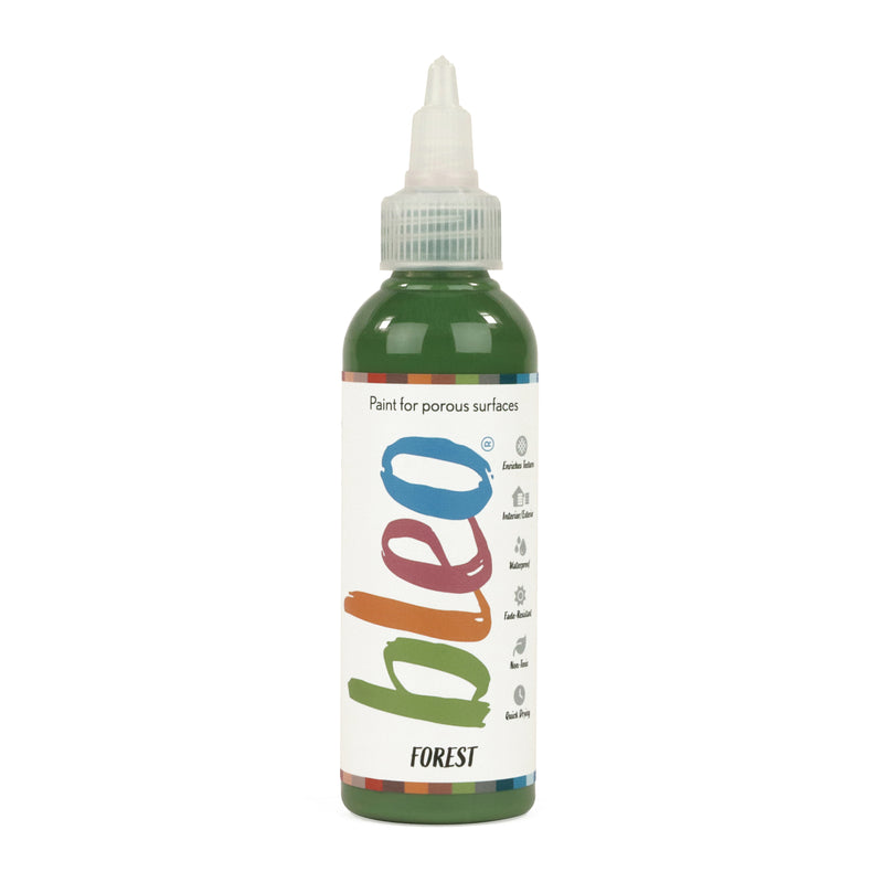 A bottle containing coloured gel paint, on a white background of bleo forest