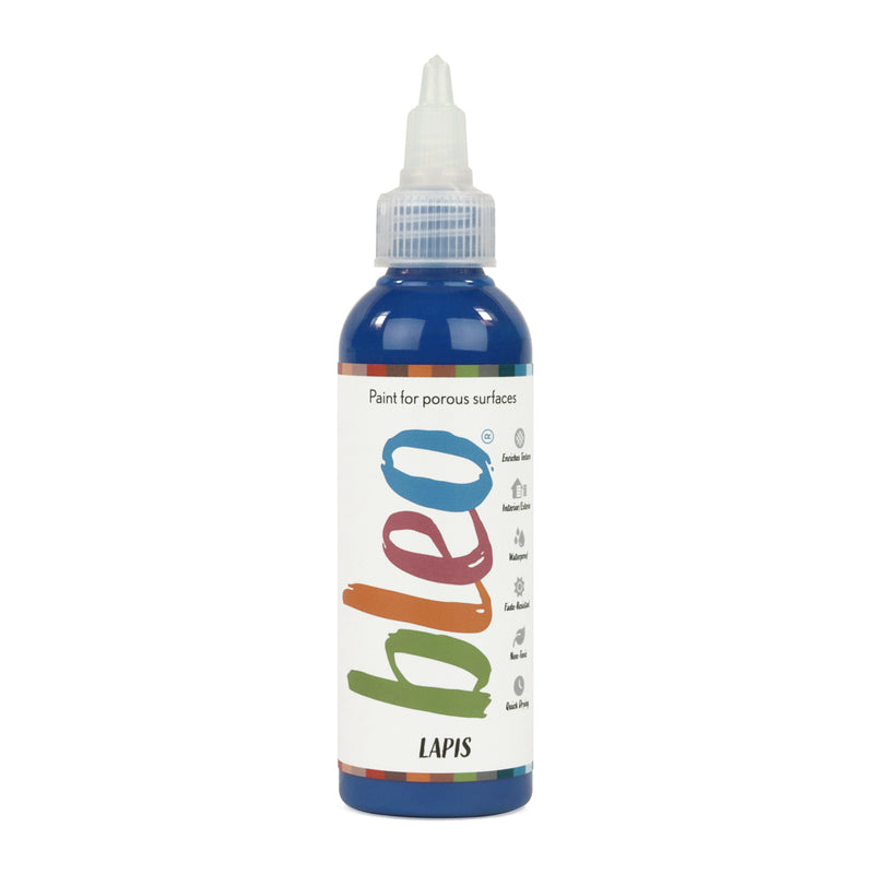 A bottle containing coloured gel paint, on a white background of bleo lapis