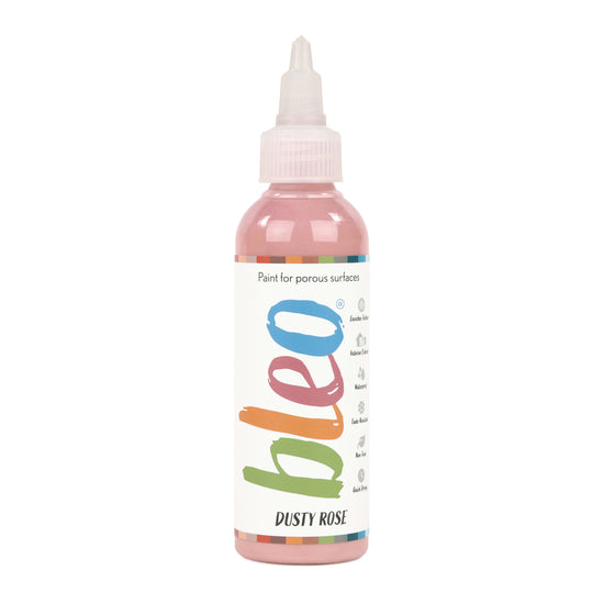 A bottle containing coloured gel paint, on a white background of bleo dusty rose