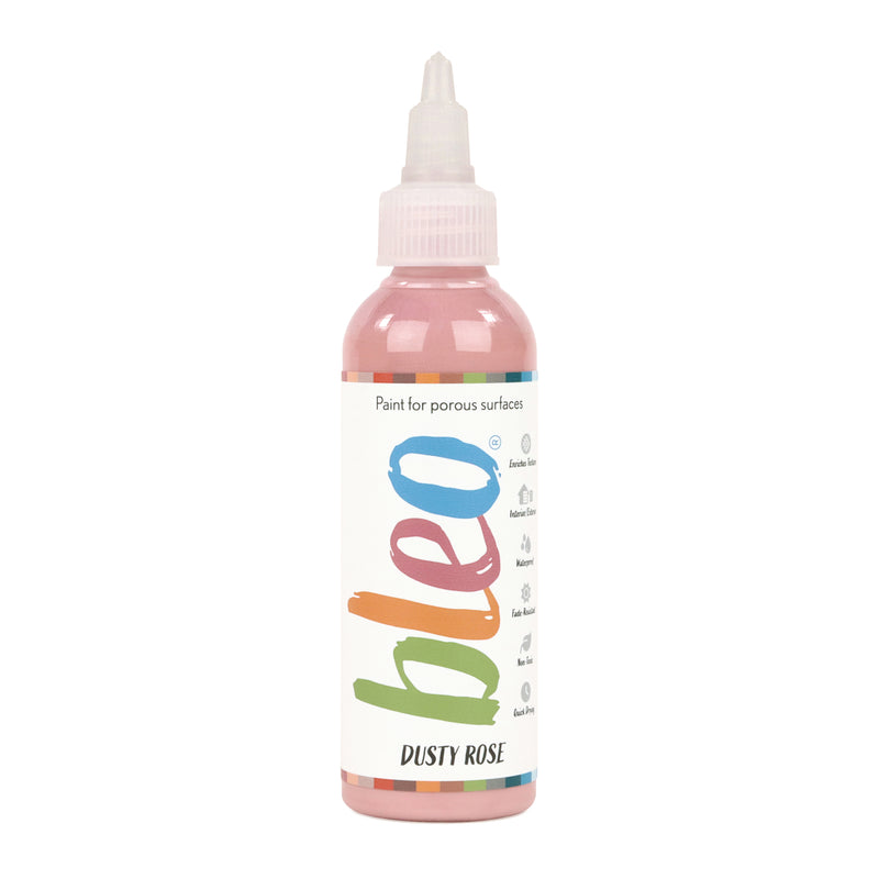 A bottle containing coloured gel paint, on a white background of bleo dusty rose