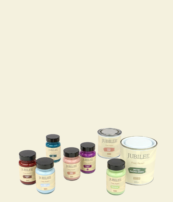 Collection of Jubilee paint jars on a cream background