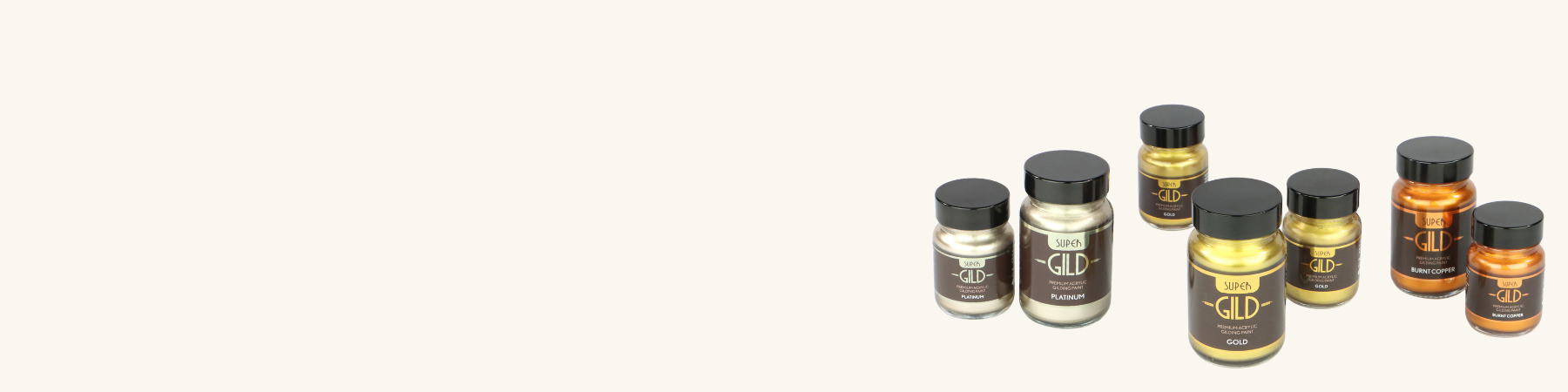 Set of small metallic paint jars on a white background