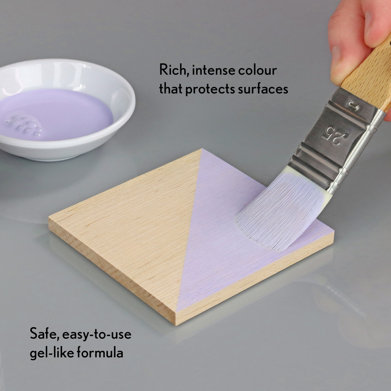 Person applying purple gel-like substance to a wooden block with a brush, text describing product features.