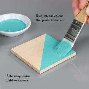 
                      
                        Teal paint being applied to a wooden surface with text describing its properties.
                      
                    