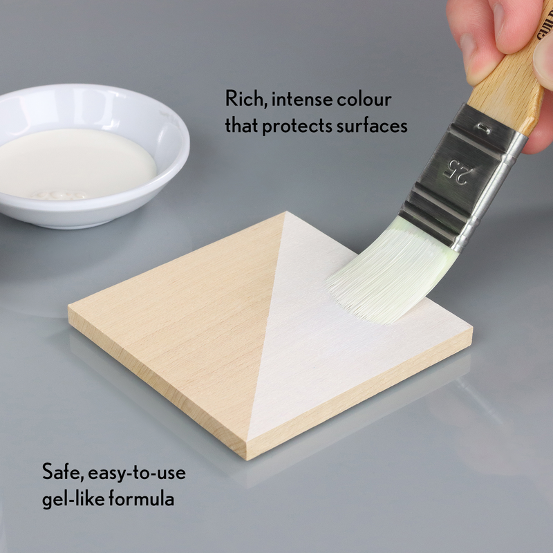 Person applying a gel-like substance to a wooden block with text describing its properties.