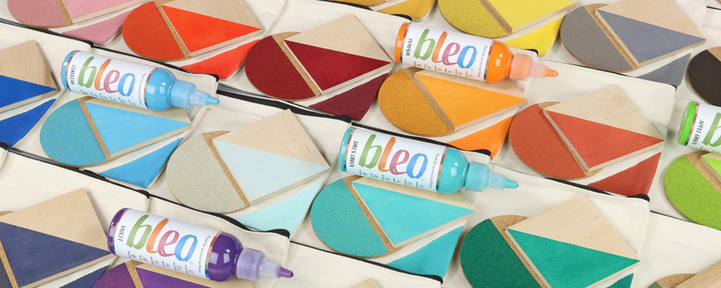 Colourful tubes of bubble gum on a geometric-patterned background