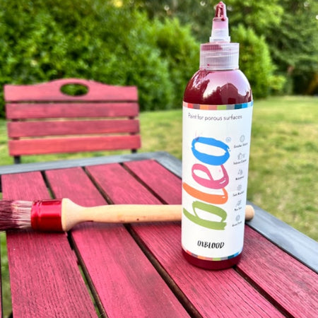 A garden table painted in Bleo Oxblood