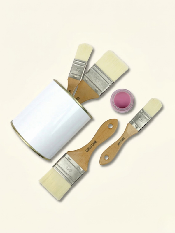 Flat lay of mottler synthetic brushes with a wooden handle