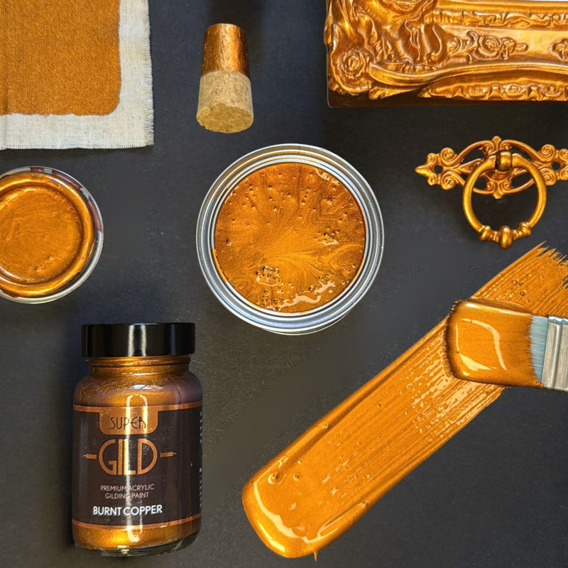 Super GILD burnt copper metallic painted items and materials on a dark surface