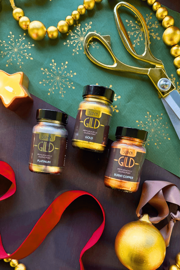 GLD products on a festive background with gold ribbons and decorations