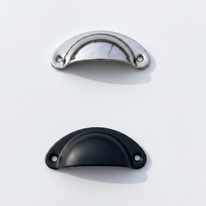 
                      
                        Two metallic cabinet handles, one metallic chrome mirror silver and one black, on a white background.
                      
                    