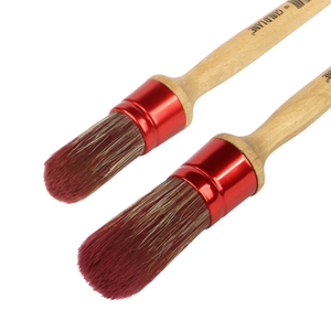 
                      
                        Two wooden brushes with red ferrules on a white background
                      
                    