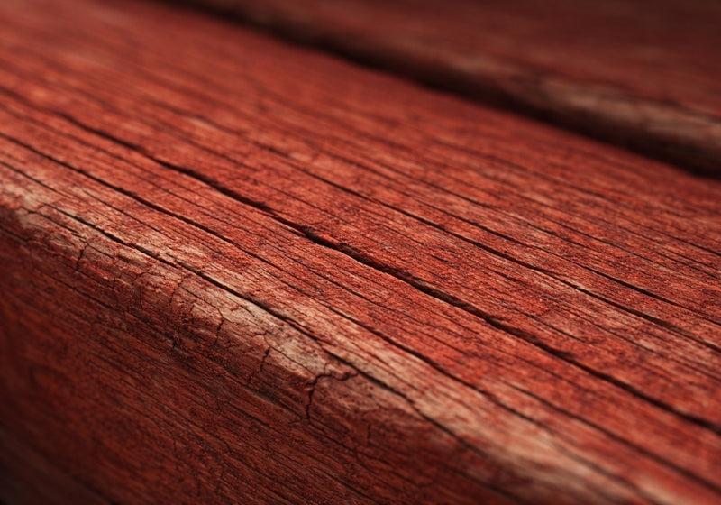 Falu red pigment absorbed into weathered timber