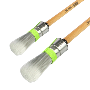 
                      
                        Two paint brushes with wooden handles and metal ferrules on a white background
                      
                    