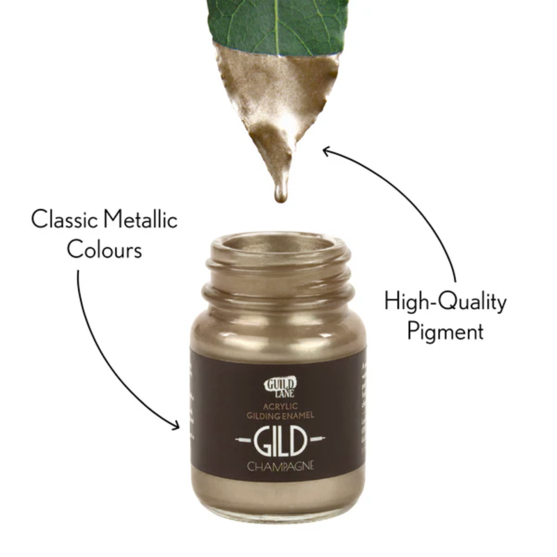 Leaf dipping into a jar of champagne paint