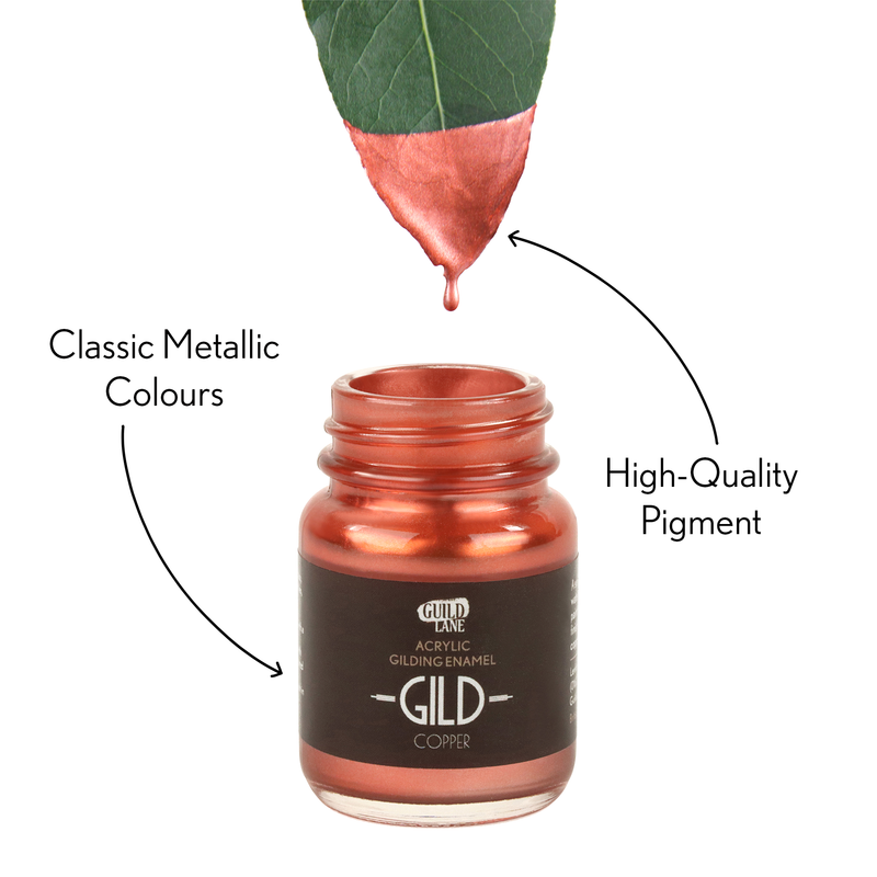 Bottle of Gild acrylic gilding enamel with a droplet of copper color on a white background