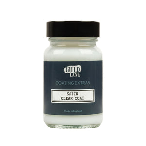 A jar of Guild Lane Satin Clear Coat, a coating extras product, with the label indicating it is made in England.