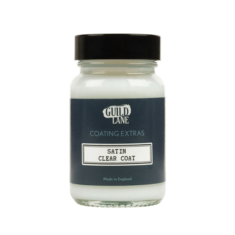 A jar of Guild Lane Satin Clear Coat, a coating extras product, with the label indicating it is made in England.