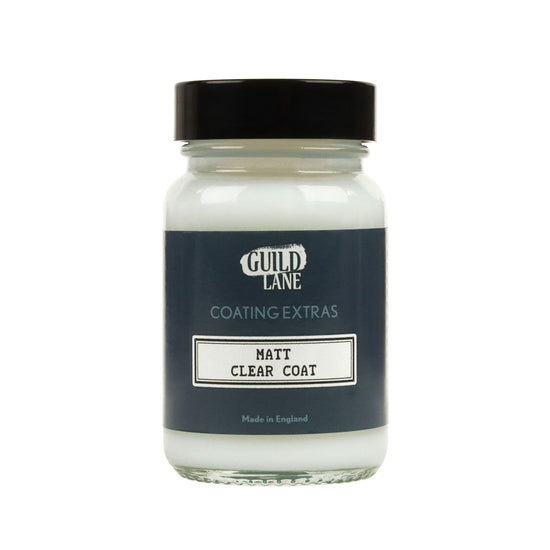 A jar of 'Guild Lane Coating Extras' Matt Clear Coat, indicating it's a matte finish coating.