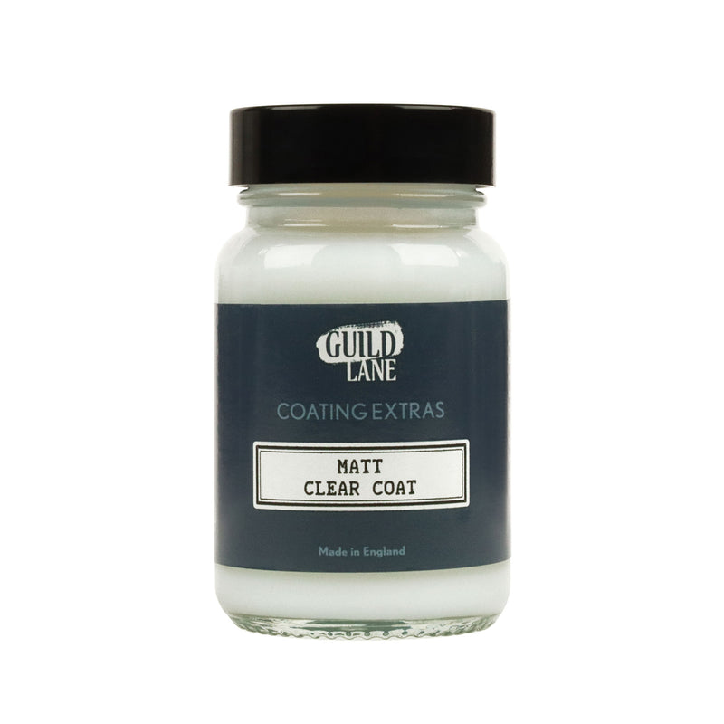 A jar of 'Guild Lane Coating Extras' Matt Clear Coat, indicating it's a matte finish coating.
