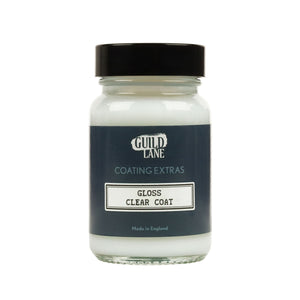A bottle of Guild Lane gloss top coat with the label clear coat indicated as gloss finish for coating extras, made in England.