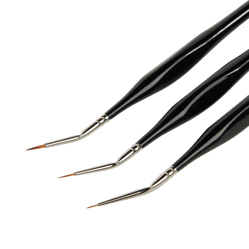 Three black paintbrushes with silver ferrules on a white background