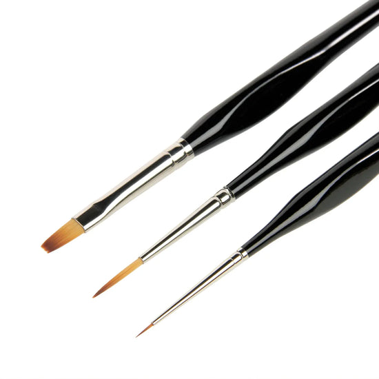 Three paintbrushes with black handles on a white background