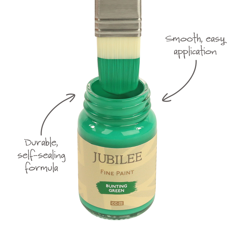 Bottle of Jubilee Fine Paint with a brush dipping into it, labeled for smooth application and durable formula.