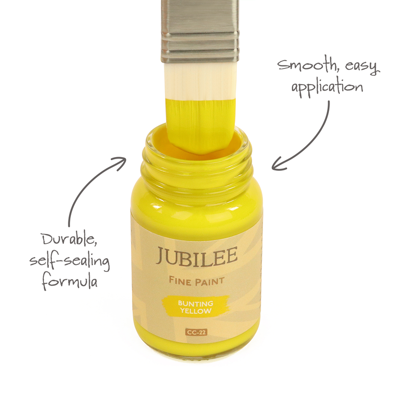 Yellow paint bottle with brush applicator labeled 'Jubilee Fine Paint' on a white background.