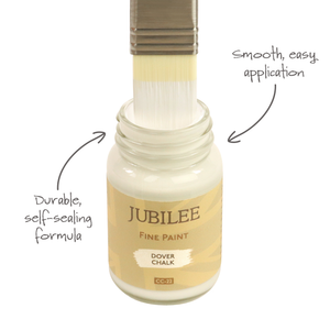 
                      
                        Jubilee Fine Paint bottle with brush applying paint, labeled 'Dover Chalk'.
                      
                    