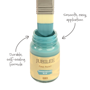 
                      
                        Jubilee Fine Paint jar with a brush dipping into it, labeled 'Durable, self-scaling formula' and 'Smooth, easy application'.
                      
                    