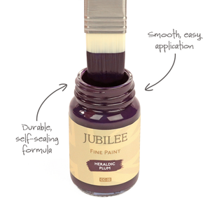 
                      
                        Bottle of Jubilee Fine Paint with a brush applying paint, labeled 'Heraldic Plum'.
                      
                    