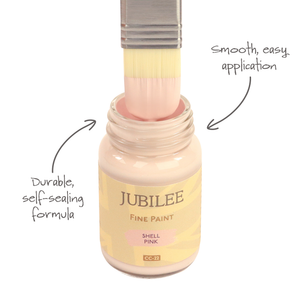 
                      
                        Jubilee Fine Paint bottle with a brush applying paint, labeled for smooth application and durable formula.
                      
                    