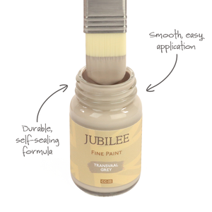 
                      
                        Jubilee Fine Paint bottle with a brush applying paint, labeled for smooth application and durable formula.
                      
                    