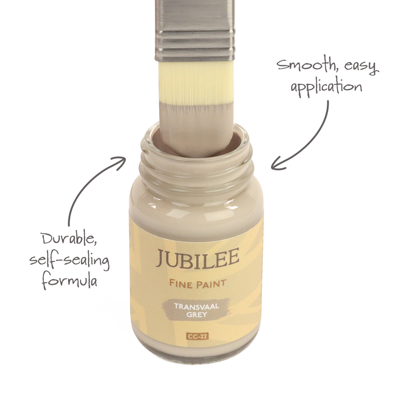 Jubilee Fine Paint bottle with a brush applying paint, labeled for smooth application and durable formula.