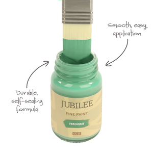 
                      
                        Bottle of Jubilee Fine Paint with a brush dipping into it, labeled 'Durable, self-scaling formula' and 'Smooth, easy application'.
                      
                    