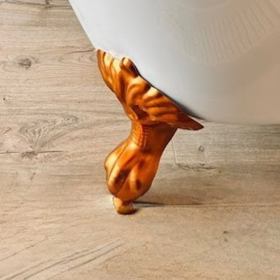 Wooden footstool with a white bathtub on a wooden floor