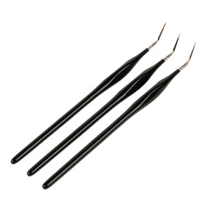 
                      
                        Three black paintbrushes with gold ferrules on a white background
                      
                    