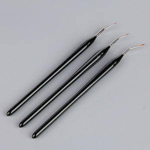 
                      
                        Three black art brushes on a grey background
                      
                    