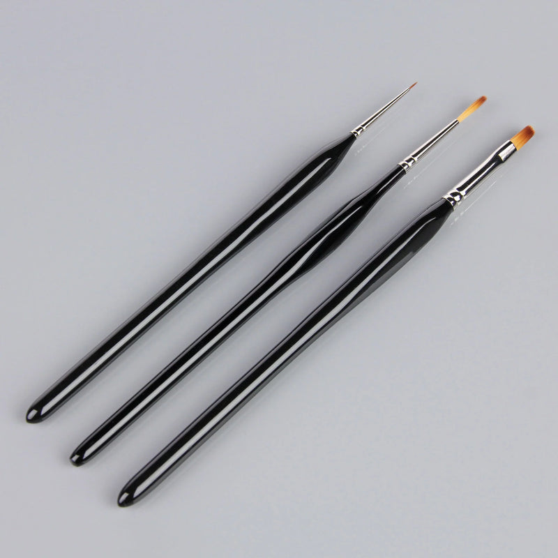 Three black paintbrushes with silver ferrules on a grey background