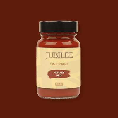 Jar of Jubilee Fine Paint in Murrey Red on a brown background