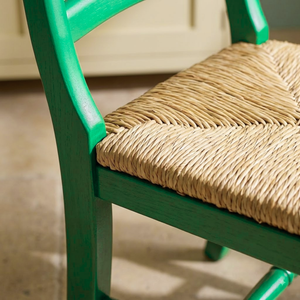 
                      
                        A bright green painted chair
                      
                    