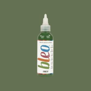 Bottle of bleo forest paint on a green background