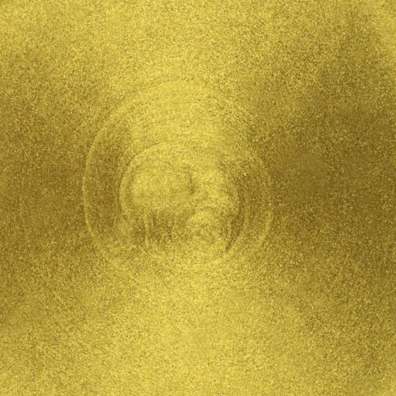 Gold metallic paint close up of paint pigment