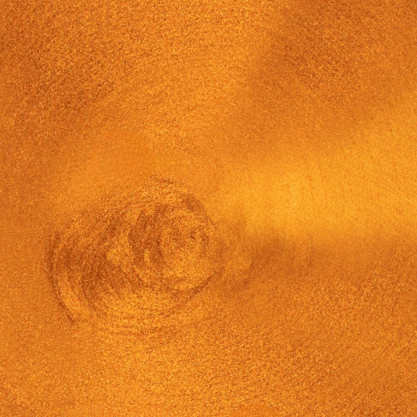 Close-up of burnt copper metallic paint in a tin